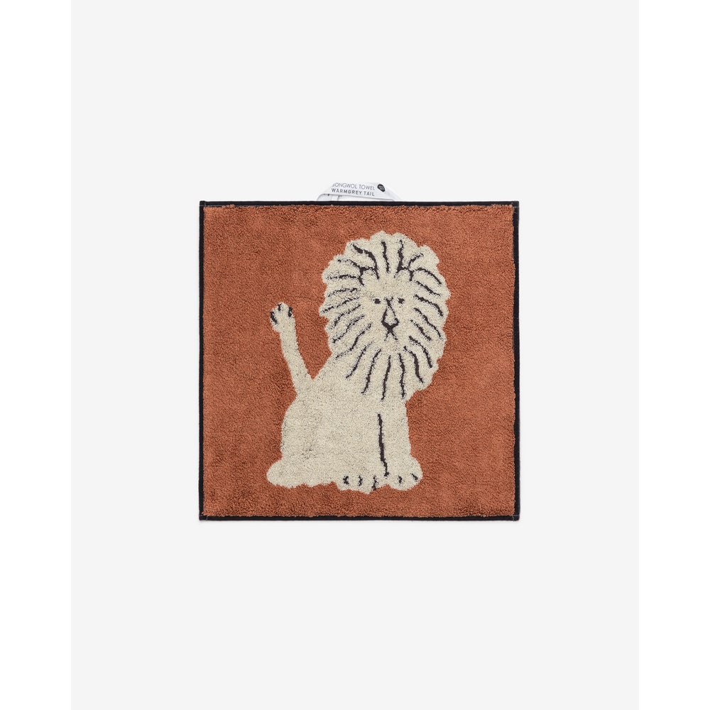 Warmgreytail Frottier Handtuch Lion Cream, mit sitzendem Loewen, mit braun-weisser Vorderseite.
